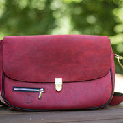 Red handbag over the shoulder